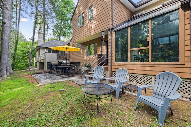 17 Font Hill Park Unit 17, Bloomfield, CT 06002 - rear view of property with an outdoor fire pit, a patio area, and a deck