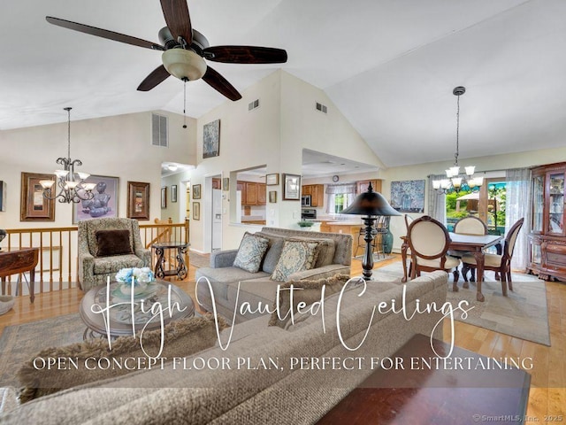 7 Sylvan Rd, Danbury, CT 06811 - living room featuring a chandelier, wood finished floors, high vaulted ceiling, and ceiling fan