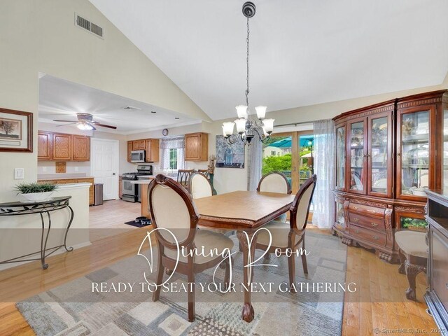 7 Sylvan Rd, Danbury, CT 06811 - dining room featuring light wood-style floors, a chandelier, high vaulted ceiling, and ceiling fan