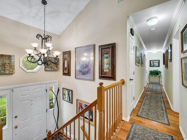 7 Sylvan Rd, Danbury, CT 06811 - foyer featuring light wood-type flooring, a chandelier, lofted ceiling, and crown molding