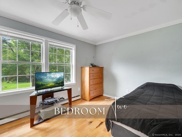 7 Sylvan Rd, Danbury, CT 06811 - bedroom with crown molding, wood finished floors, a ceiling fan, and baseboard heating