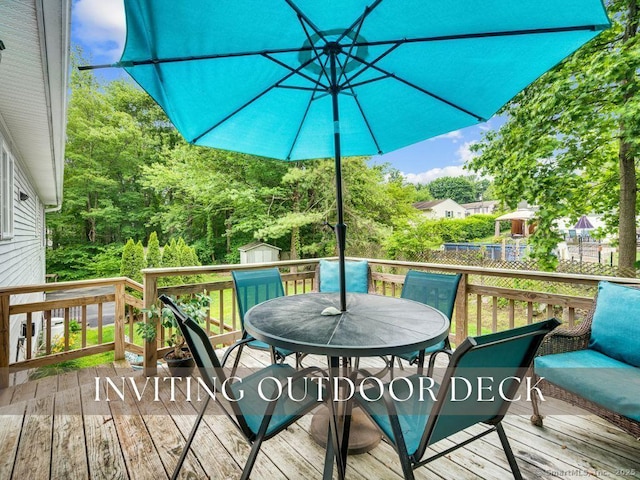 7 Sylvan Rd, Danbury, CT 06811 - deck featuring a storage unit and outdoor dining area