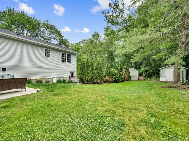 7 Sylvan Rd, Danbury, CT 06811 - view of grassy yard featuring a storage shed and a patio