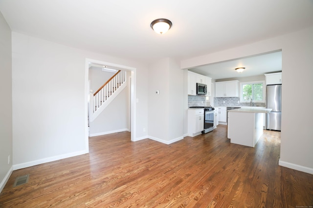 30 Ward Pl, West Haven, CT 06516 - unfurnished living room with wood finished floors and stairs