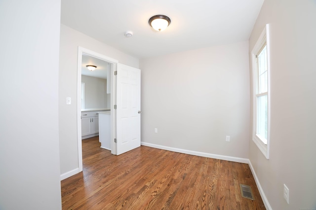 30 Ward Pl, West Haven, CT 06516 - unfurnished bedroom with wood finished floors and baseboards