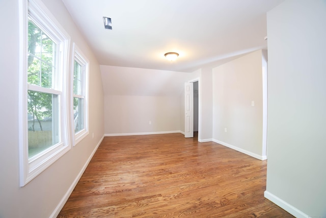 30 Ward Pl, West Haven, CT 06516 - spare room with wood finished floors and lofted ceiling