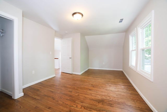 30 Ward Pl, West Haven, CT 06516 - spare room with wood finished floors and lofted ceiling
