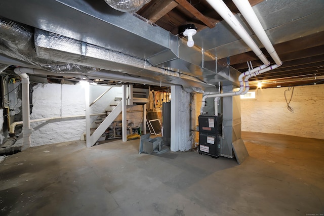30 Ward Pl, West Haven, CT 06516 - unfinished below grade area featuring stairs, heating unit, and gas water heater