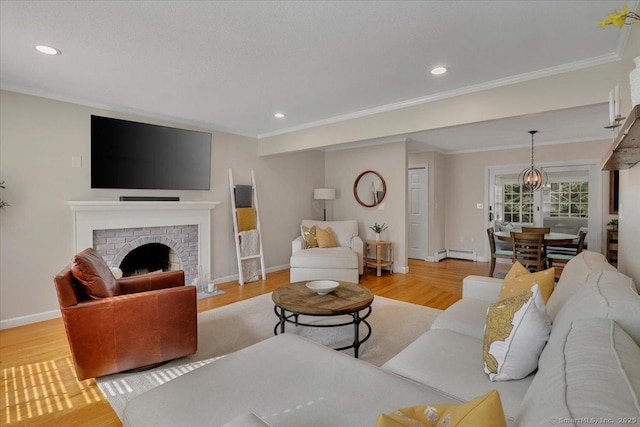 15 Thompson Hill Rd, Canton, CT 06019 - living area featuring wood finished floors, recessed lighting, ornamental molding, a fireplace, and a baseboard radiator