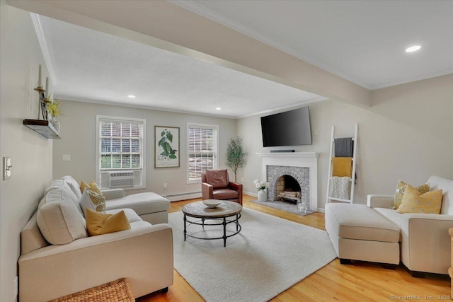 15 Thompson Hill Rd, Canton, CT 06019 - living area featuring baseboard heating, light wood-style floors, recessed lighting, a fireplace, and ornamental molding