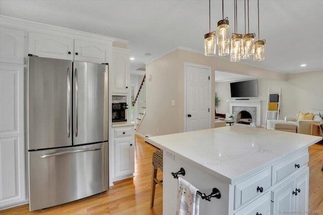 15 Thompson Hill Rd, Canton, CT 06019 - kitchen featuring freestanding refrigerator, white cabinetry, a center island, open floor plan, and light wood finished floors