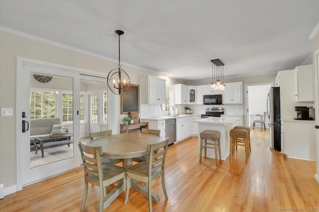 15 Thompson Hill Rd, Canton, CT 06019 - dining space featuring ornamental molding, a chandelier, and light wood-style floors