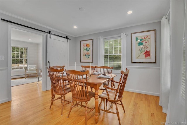15 Thompson Hill Rd, Canton, CT 06019 - dining area with a barn door, healthy amount of natural light, crown molding, light wood-style floors, and a baseboard radiator