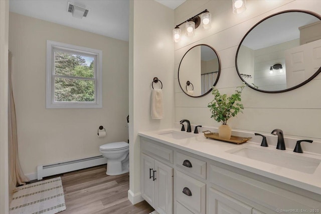 15 Thompson Hill Rd, Canton, CT 06019 - full bathroom with baseboard heating, double vanity, wood finished floors, and a shower with curtain