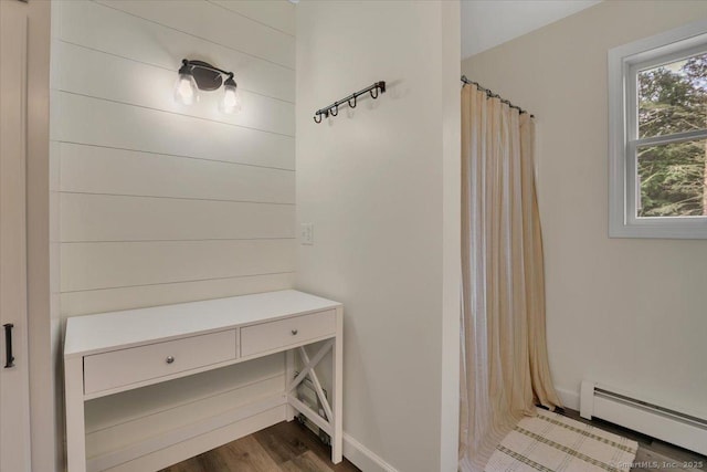 15 Thompson Hill Rd, Canton, CT 06019 - bathroom with a baseboard heating unit, wood finished floors, and curtained shower
