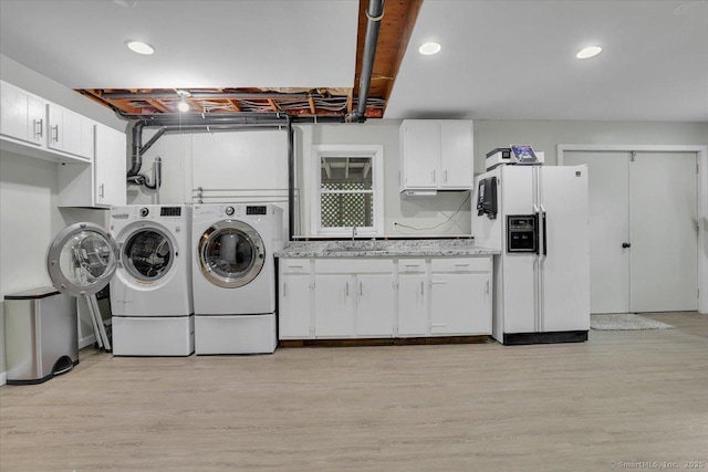 15 Thompson Hill Rd, Canton, CT 06019 - laundry area with independent washer and dryer, light wood finished floors, cabinet space, and recessed lighting