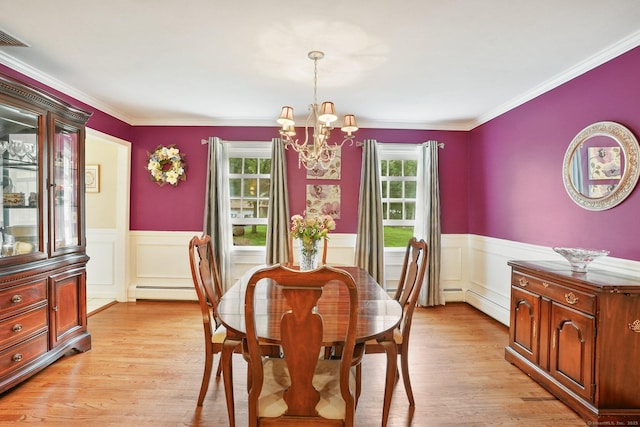 58 Inca Dr, Trumbull, CT 06611 - dining room with a chandelier, plenty of natural light, baseboard heating, a wainscoted wall, and crown molding