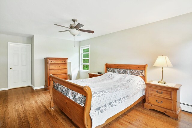 58 Inca Dr, Trumbull, CT 06611 - bedroom featuring wood finished floors, a ceiling fan, and baseboard heating