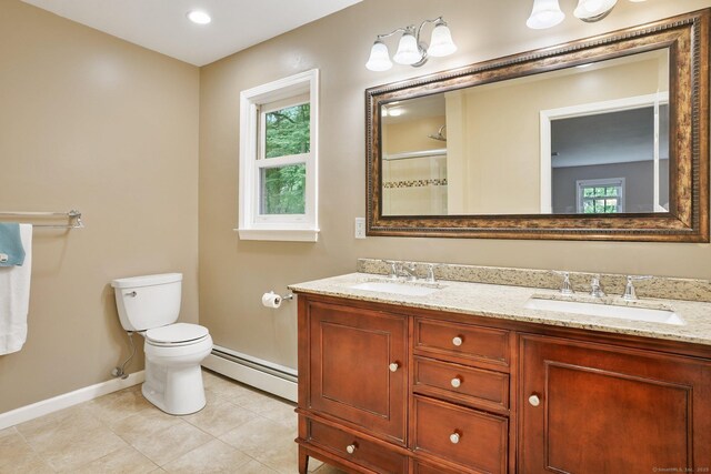58 Inca Dr, Trumbull, CT 06611 - full bath with a baseboard heating unit, double vanity, tile patterned floors, and a shower