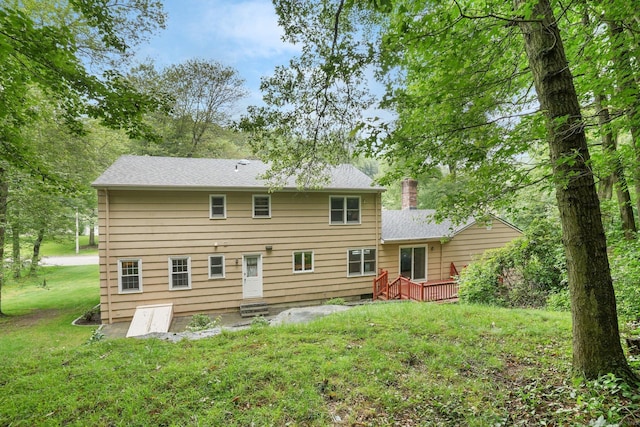 58 Inca Dr, Trumbull, CT 06611 - back of property featuring a wooden deck, a lawn, and a chimney
