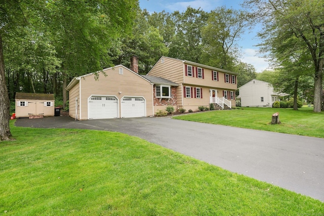58 Inca Dr, Trumbull, CT 06611 - colonial house with a garage, a storage unit, driveway, a chimney, and a front yard