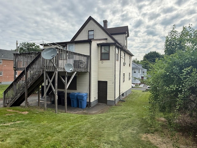 122 Wilcox St, New Britain, CT 06051 - back of house with a yard, a wooden deck, stairway, and a chimney