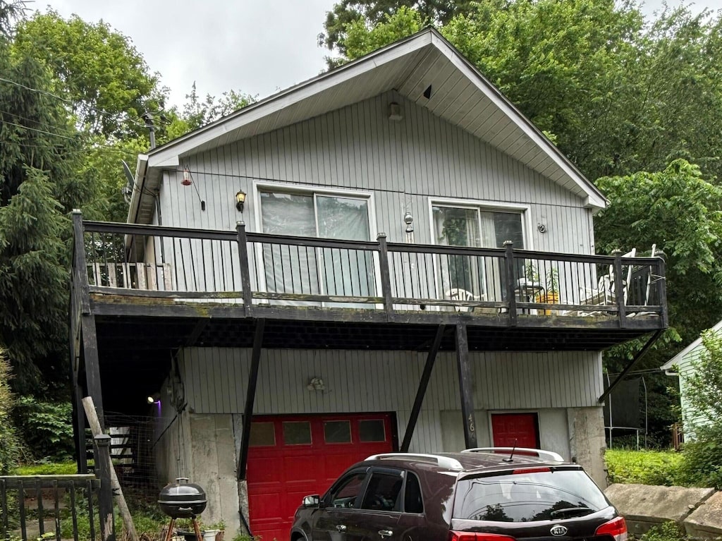 466 Waterville St, Waterbury, CT 06710 - view of front of home featuring a deck, a garage, and stairway