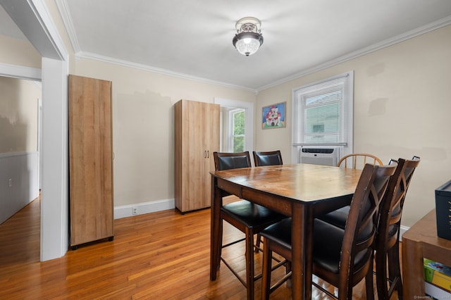 89 Geer Ave, Norwich, CT 06360 - dining space featuring light wood finished floors, cooling unit, and crown molding