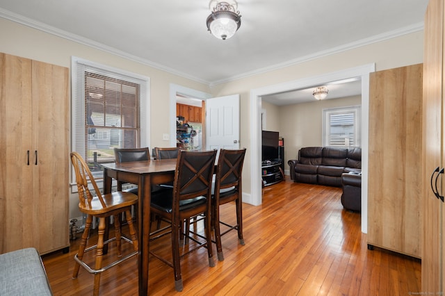 89 Geer Ave, Norwich, CT 06360 - dining room featuring crown molding and light wood-style flooring