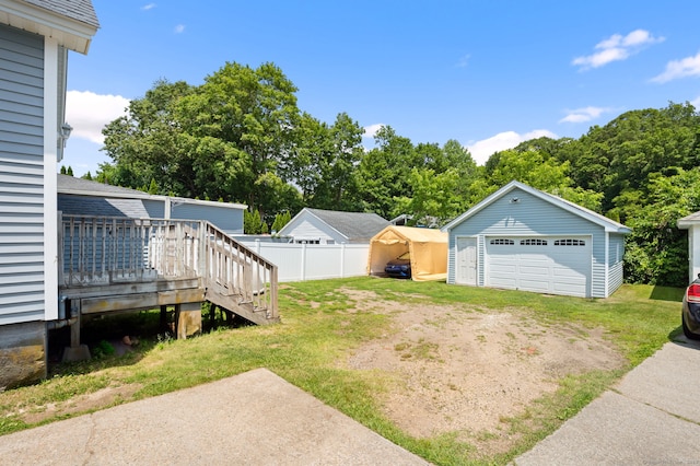 89 Geer Ave, Norwich, CT 06360 - view of yard featuring a detached garage, an outdoor structure, and a deck