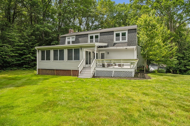 28 Saddle Ridge Dr, Simsbury, CT 06092 - rear view of property featuring a wooden deck, a shingled roof, a yard, and a chimney