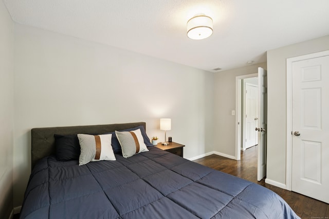 28 Saddle Ridge Dr, Simsbury, CT 06092 - bedroom featuring dark wood-style flooring and baseboards