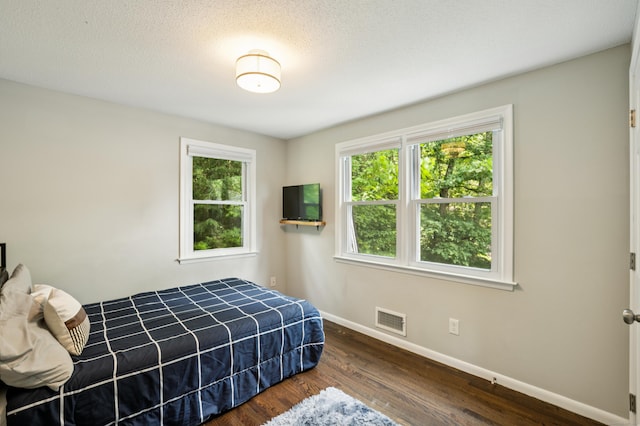 28 Saddle Ridge Dr, Simsbury, CT 06092 - bedroom with baseboards and dark wood finished floors