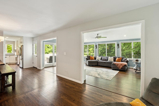 28 Saddle Ridge Dr, Simsbury, CT 06092 - living area with dark wood-type flooring and a ceiling fan