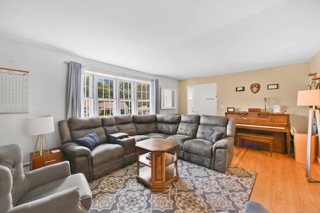 39 Alder Rd, Simsbury, CT 06070 - living area with light wood-style floors and a baseboard radiator