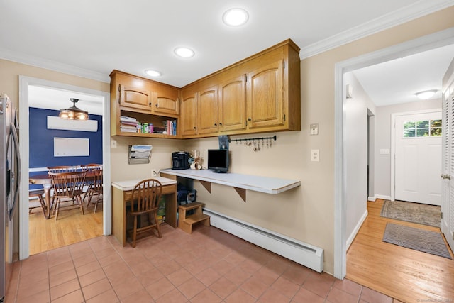 39 Alder Rd, Simsbury, CT 06070 - kitchen featuring a baseboard radiator, built in study area, crown molding, light tile patterned flooring, and light countertops