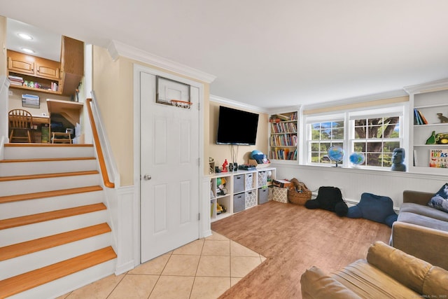 39 Alder Rd, Simsbury, CT 06070 - living area with stairs, light tile patterned flooring, ornamental molding, and built in features