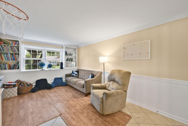 39 Alder Rd, Simsbury, CT 06070 - living area with light tile patterned flooring, a wainscoted wall, and ornamental molding