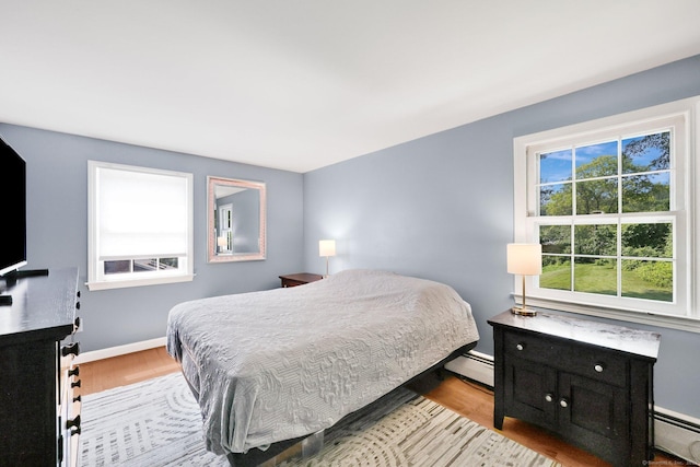 39 Alder Rd, Simsbury, CT 06070 - bedroom featuring baseboard heating and light wood-style floors