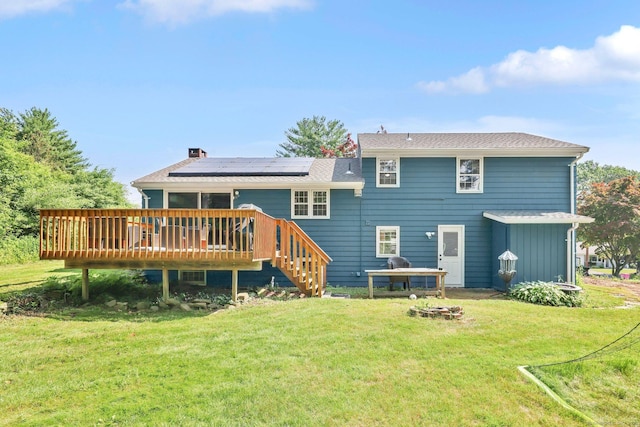 39 Alder Rd, Simsbury, CT 06070 - rear view of property with a deck, a yard, solar panels, and a chimney