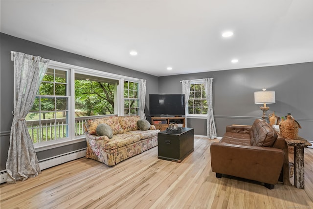 17 Mail Coach Dr, Norwalk, CT 06850 - living area with wood finished floors, recessed lighting, and a baseboard radiator