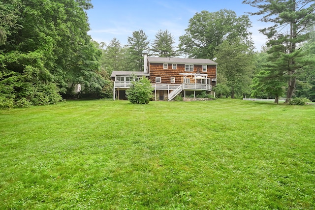 17 Mail Coach Dr, Norwalk, CT 06850 - rear view of house with stairway, a deck, and a lawn