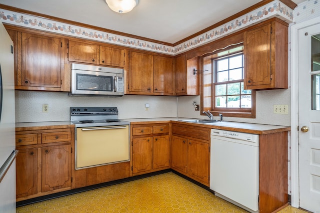 62 Eddy Ln, Newington, CT 06111 - kitchen featuring electric stove, white dishwasher, stainless steel microwave, brown cabinets, and light countertops