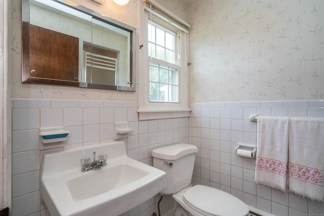 62 Eddy Ln, Newington, CT 06111 - bathroom featuring wallpapered walls, a wainscoted wall, and tile walls