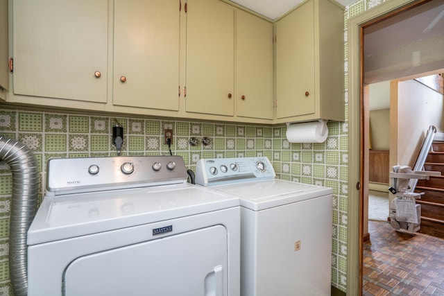 62 Eddy Ln, Newington, CT 06111 - laundry room featuring separate washer and dryer and cabinet space