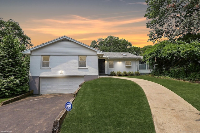 3743 Park Ave, Fairfield, CT 06825 - view of front of home with a garage, asphalt driveway, a lawn, and a wall unit AC