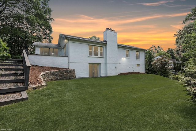 3743 Park Ave, Fairfield, CT 06825 - back of property at dusk with a chimney and a lawn