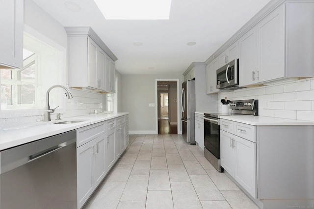 3743 Park Ave, Fairfield, CT 06825 - kitchen with stainless steel appliances, tasteful backsplash, and plenty of natural light