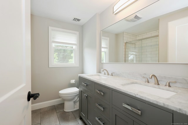 3743 Park Ave, Fairfield, CT 06825 - bathroom featuring double vanity, a tile shower, and tile patterned floors