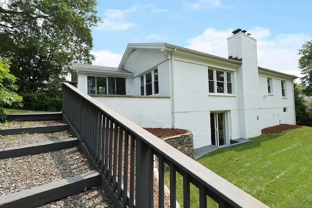 3743 Park Ave, Fairfield, CT 06825 - back of property with a chimney and a lawn